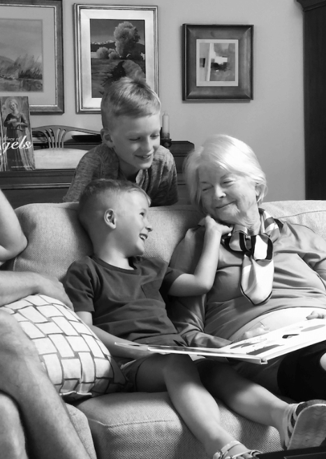 Kids visiting an elderly grandparent in their home